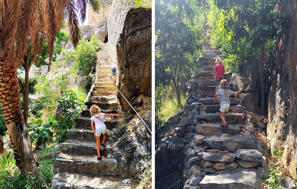 Misfat al Abriyeen trekking  - girls climbing old stairs