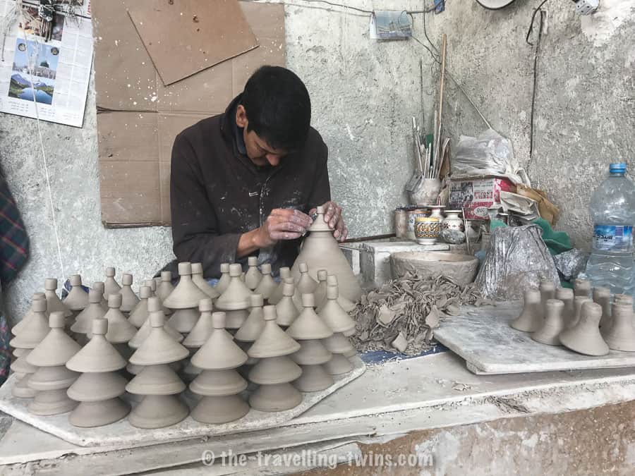 Ceramic artist - creating tajine dish 