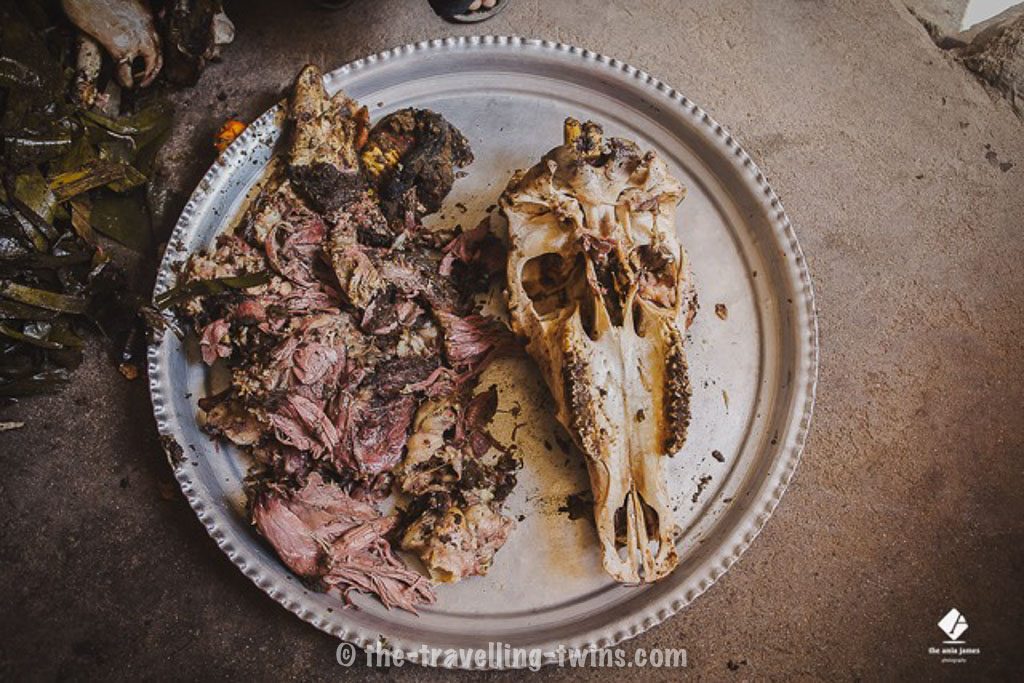 Oman food - shuwa - ox skull peel from meat